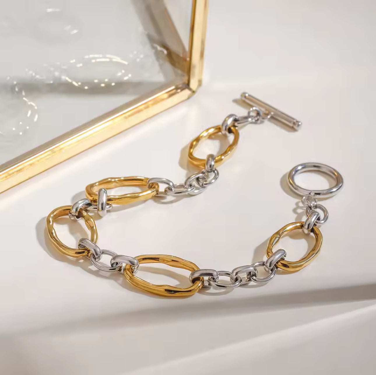 Pulsera bicolor broche