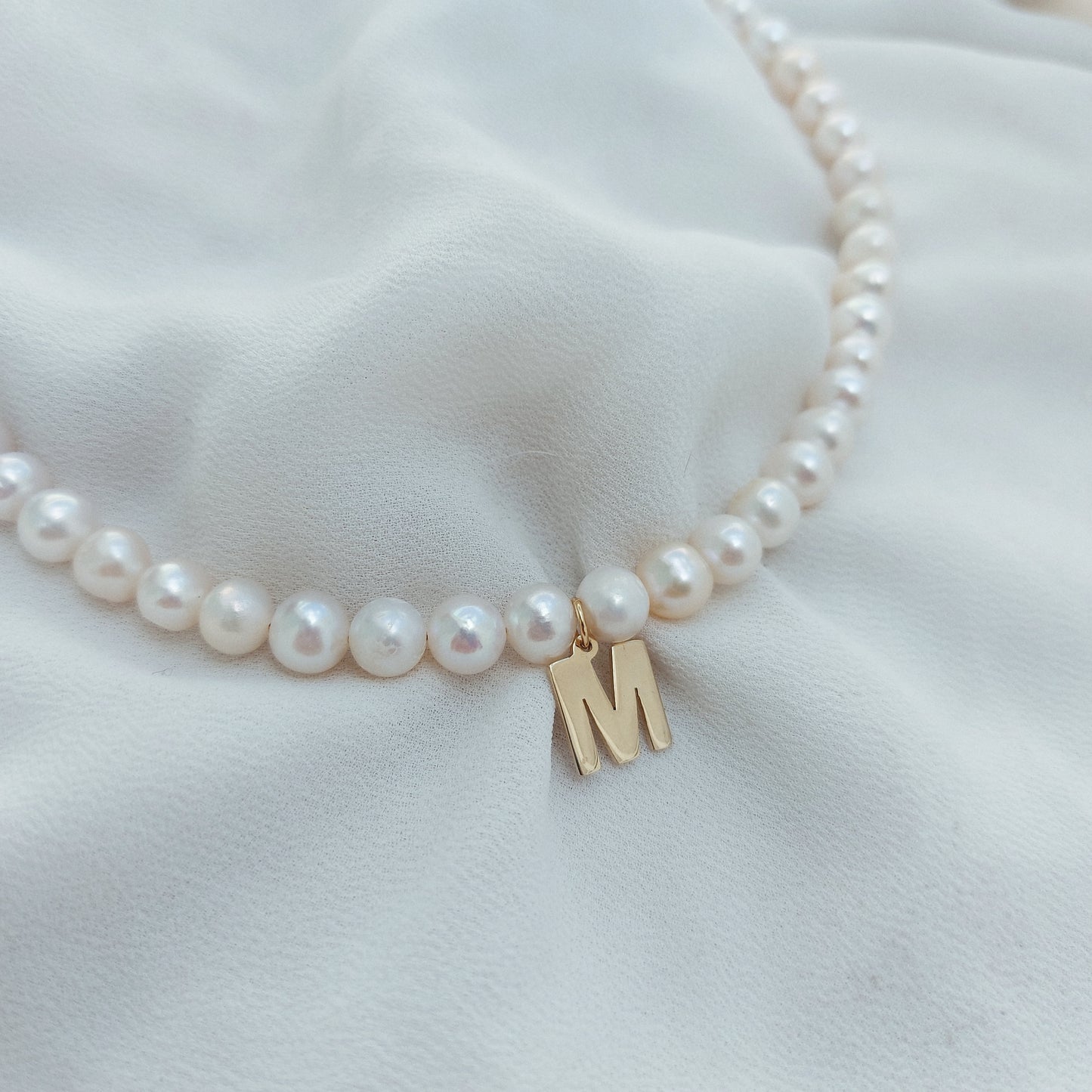 Perlas con inicial