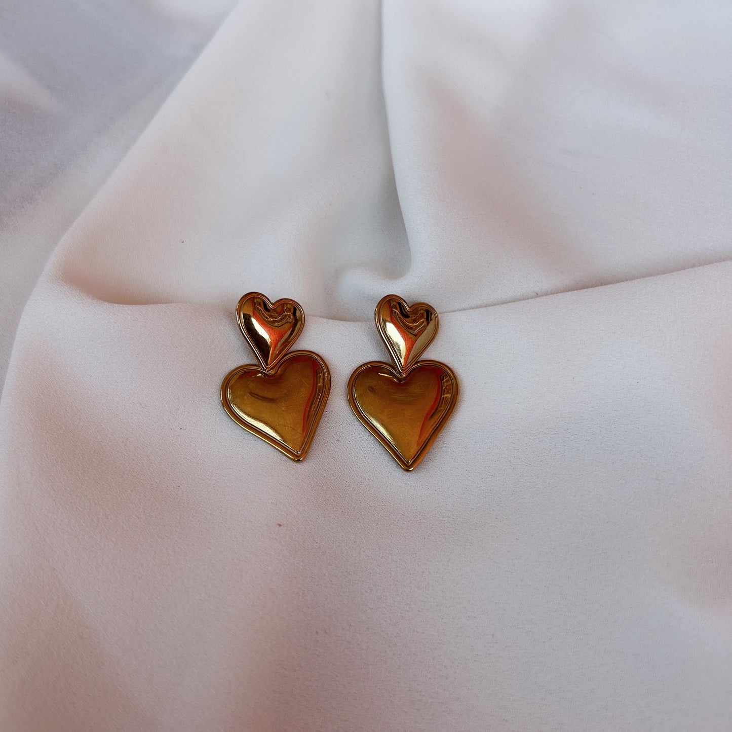 Aretes corazón doble
