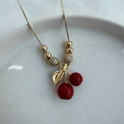 Conjunto cereza y bolitas