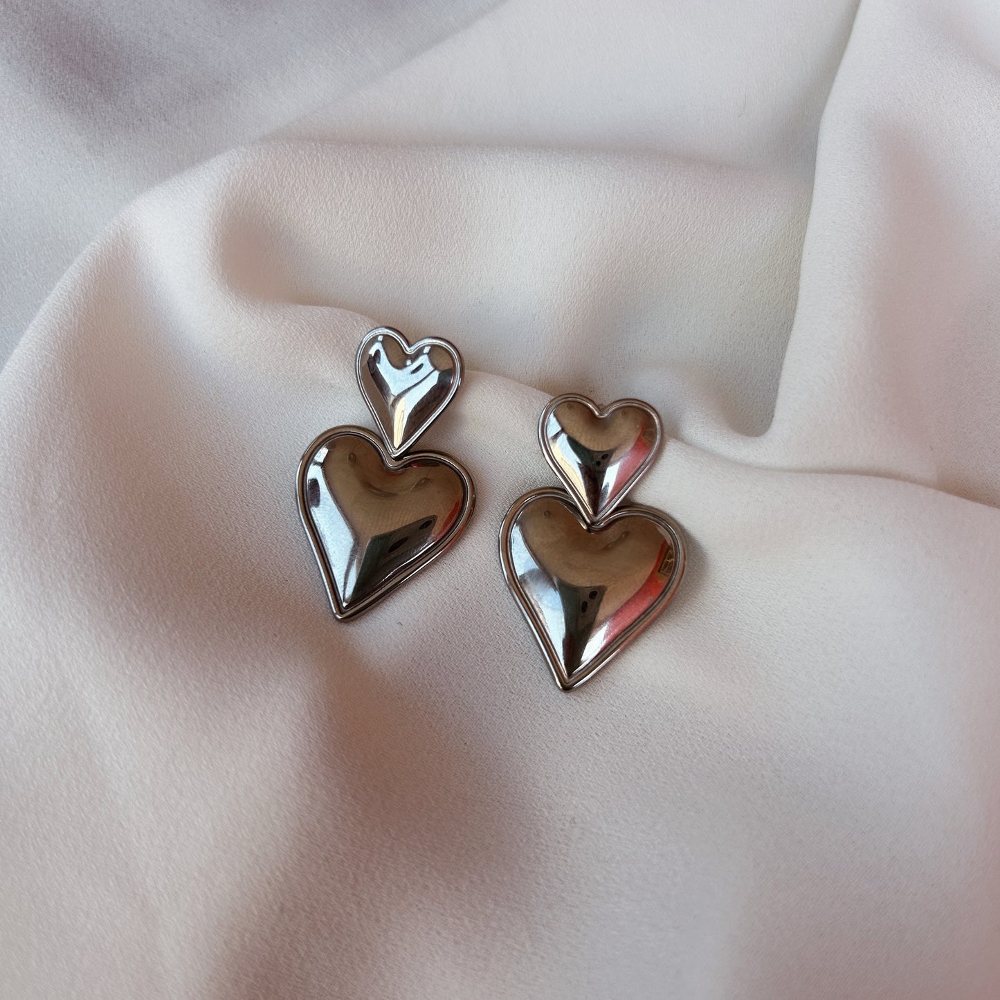 Aretes corazón doble