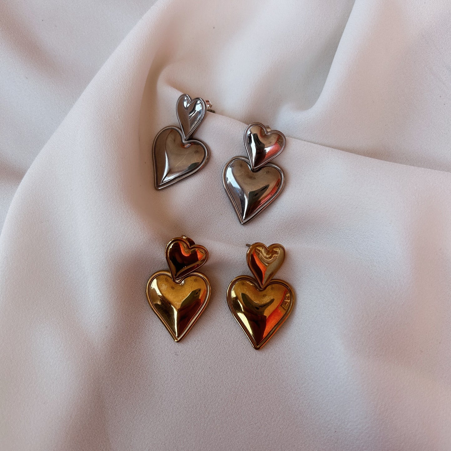 Aretes corazón doble